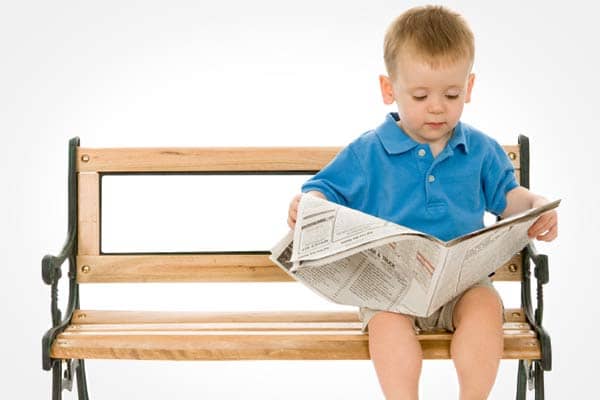 child reading newsletter